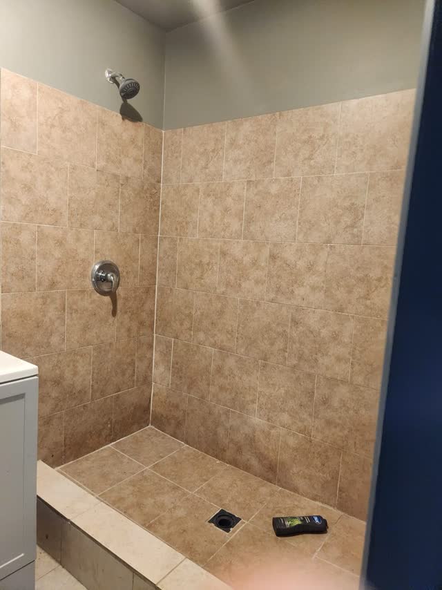 Tiled walk-in shower in the bathroom
